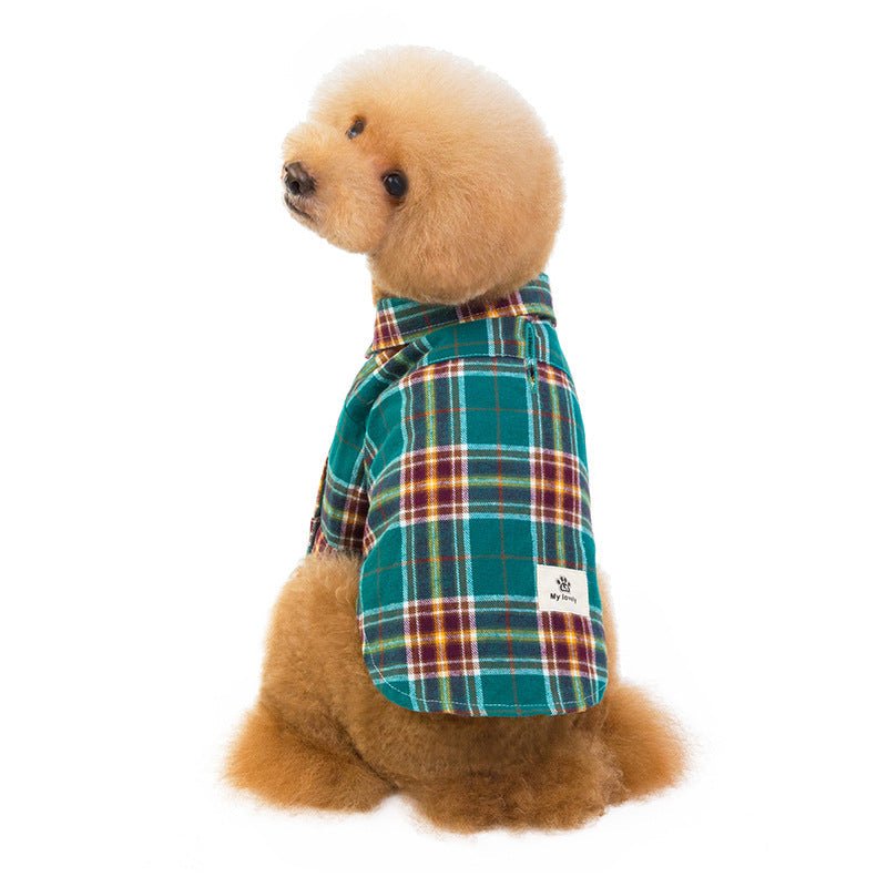 Green plaid pet shirt on dog with button front and small chest label