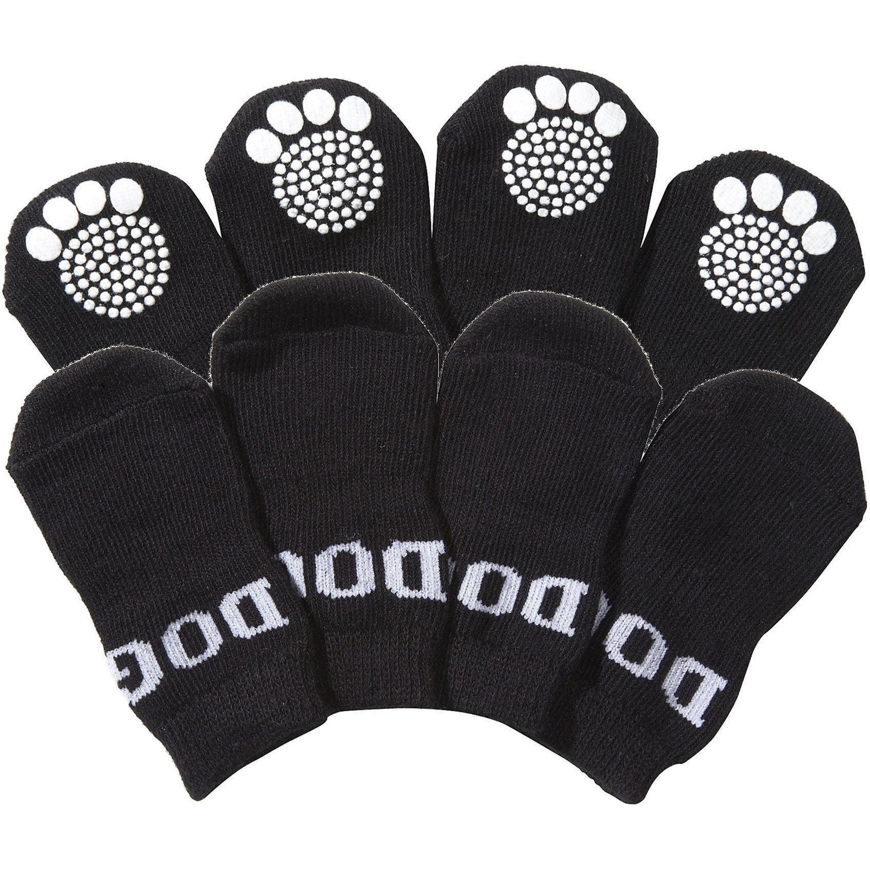 Set of black pet dog socks with white paw-print grippers on the toes