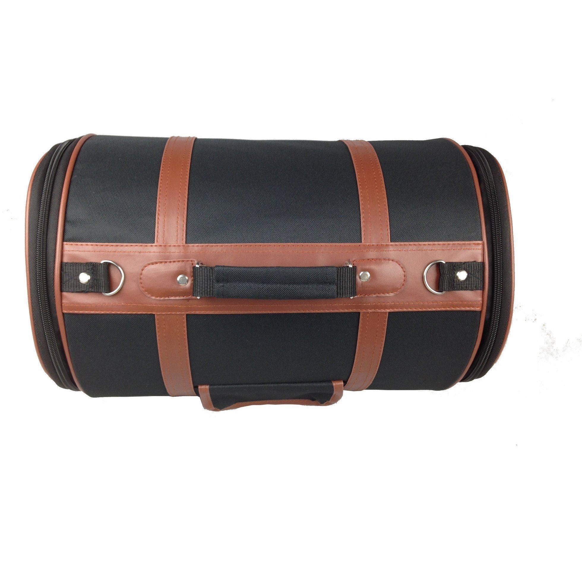 Cylindrical pet carrier with black fabric, brown cross straps, and front buckle panel