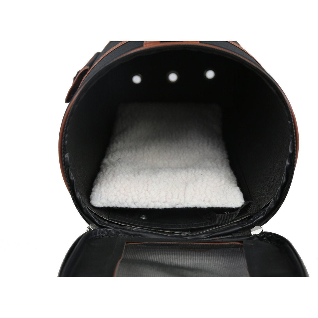 Cylindrical pet carrier interior with soft gray padding and brown-trimmed opening