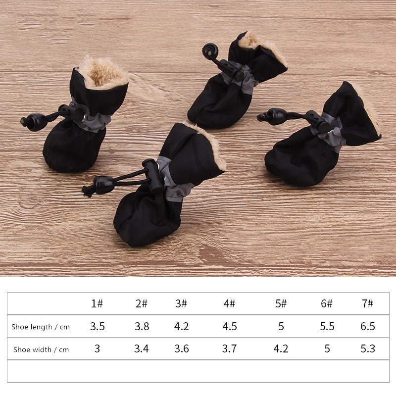Black dog soft pet shoes with faux-fur lining, round drawstring toggles, and straps.