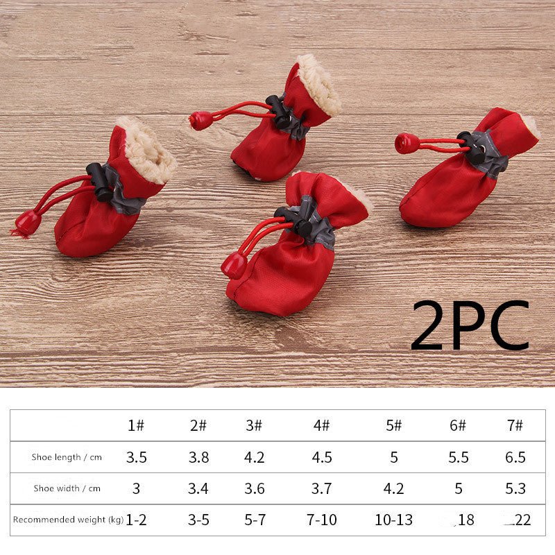 Red soft-soled dog shoes with black straps and warm fur trim