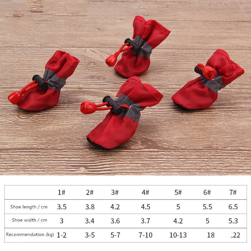 Red dog soft pet shoes with faux-fur lining, black clips, and red drawstring toggles.