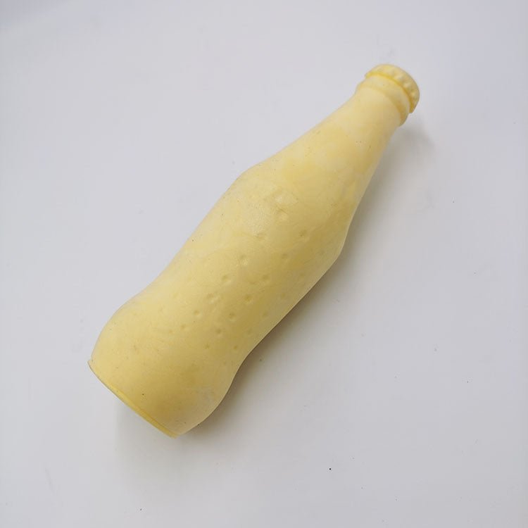 Yellow bottle-shaped pet teeth-cleaning chew toy with small textured dots