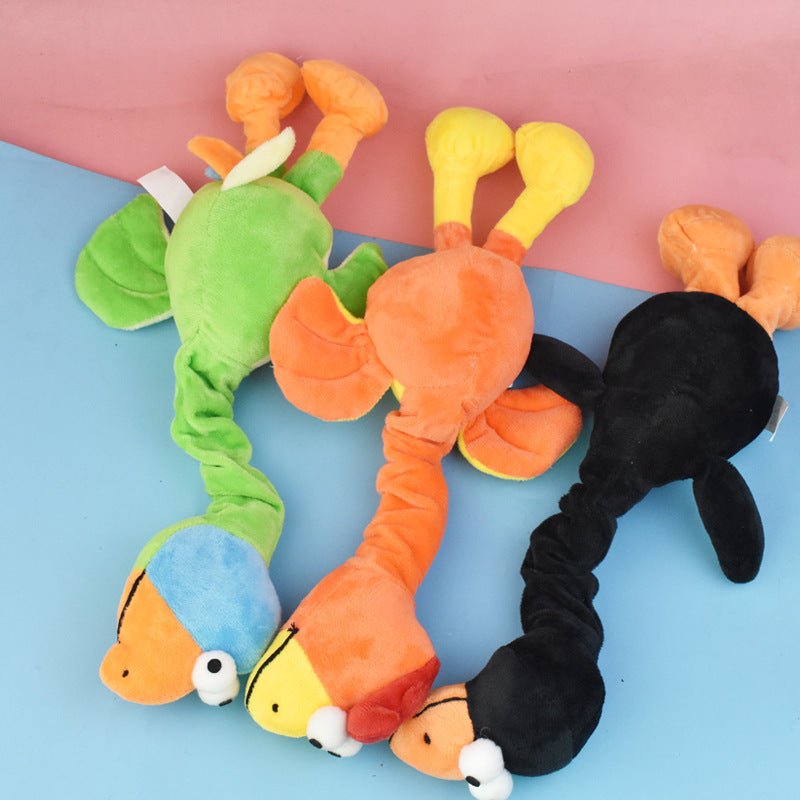 Black, orange, and green bite-resistant dog plush toy with squeaker body and legs