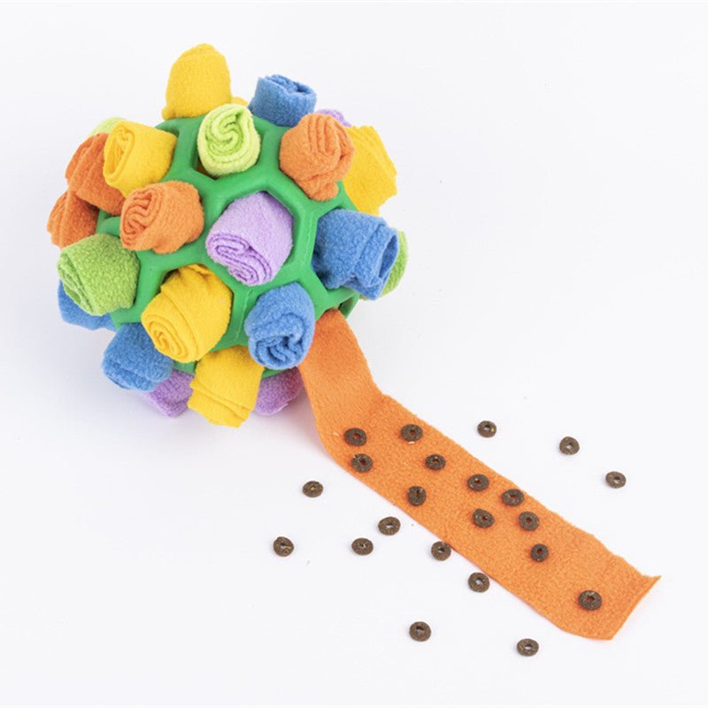 Yellow-green fleece sniff toy ball with rolled flowers and dotted orange treat handle
