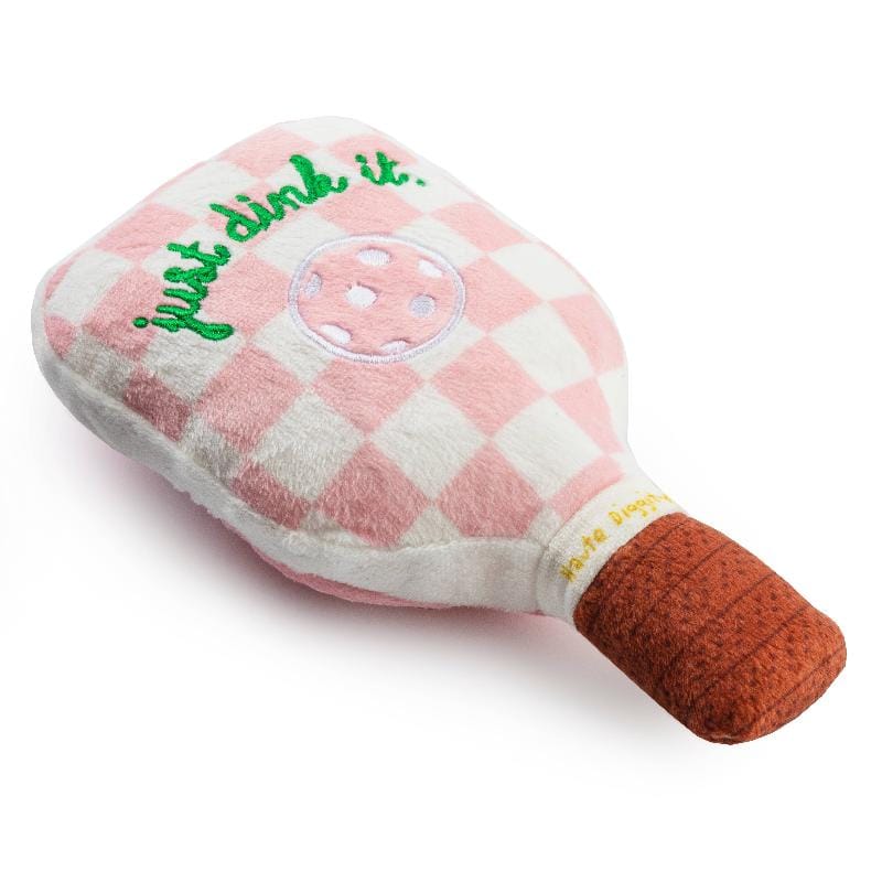 Plush dog toy pickleball paddle: pink checkered plush with green print, ball graphic, plush brown handle