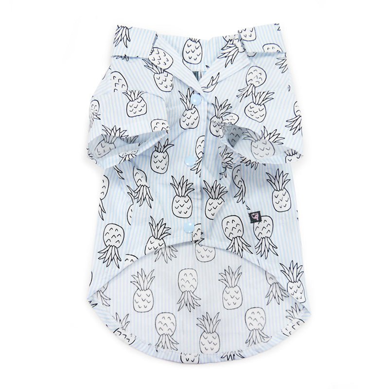 Light blue pet shirt with white pineapple doodle print, button front and gathered hem.