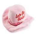 Pink plush cowgirl hat dog toy with red stitched “Let’s Go Girly!” on front
