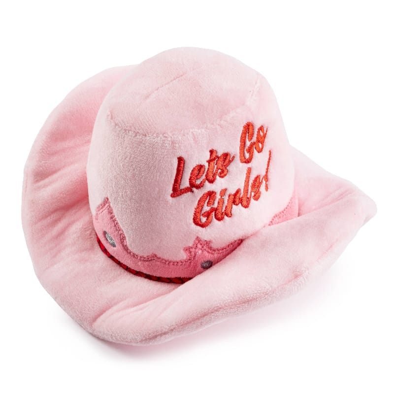 Pink plush cowgirl hat dog toy with red stitched “Let’s Go Girly!” on front