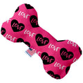 Pink dog bone toy with black heart "LOVE" print and blue label detail