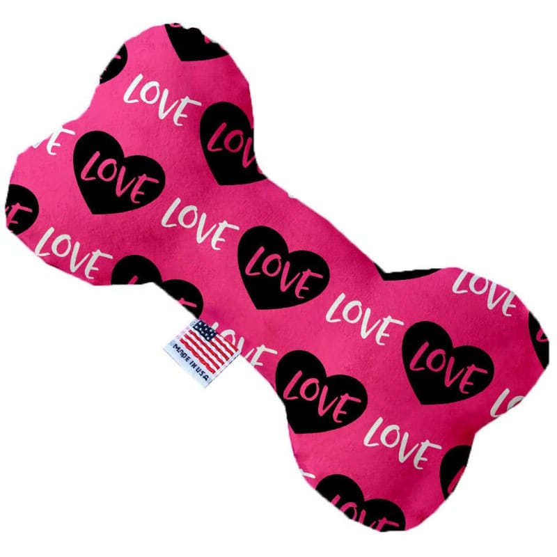Pink dog bone toy with black heart "LOVE" print and blue label detail