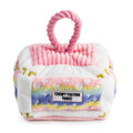 Pink ombre plush dog toy house with rope handle and Chewy Vuitton Paris label