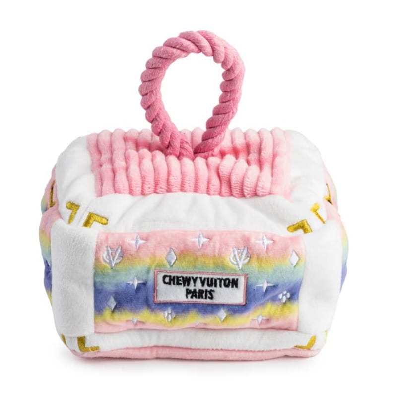 Pink ombre plush dog toy house with rope handle and Chewy Vuitton Paris label