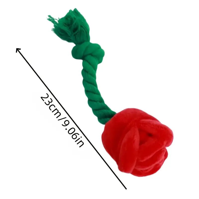 Plush dog rope tug toy, green with red rose; approx 22 in length