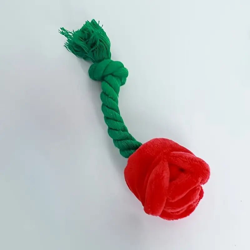 Plush dog tug toy with green rope handle and red rose plush