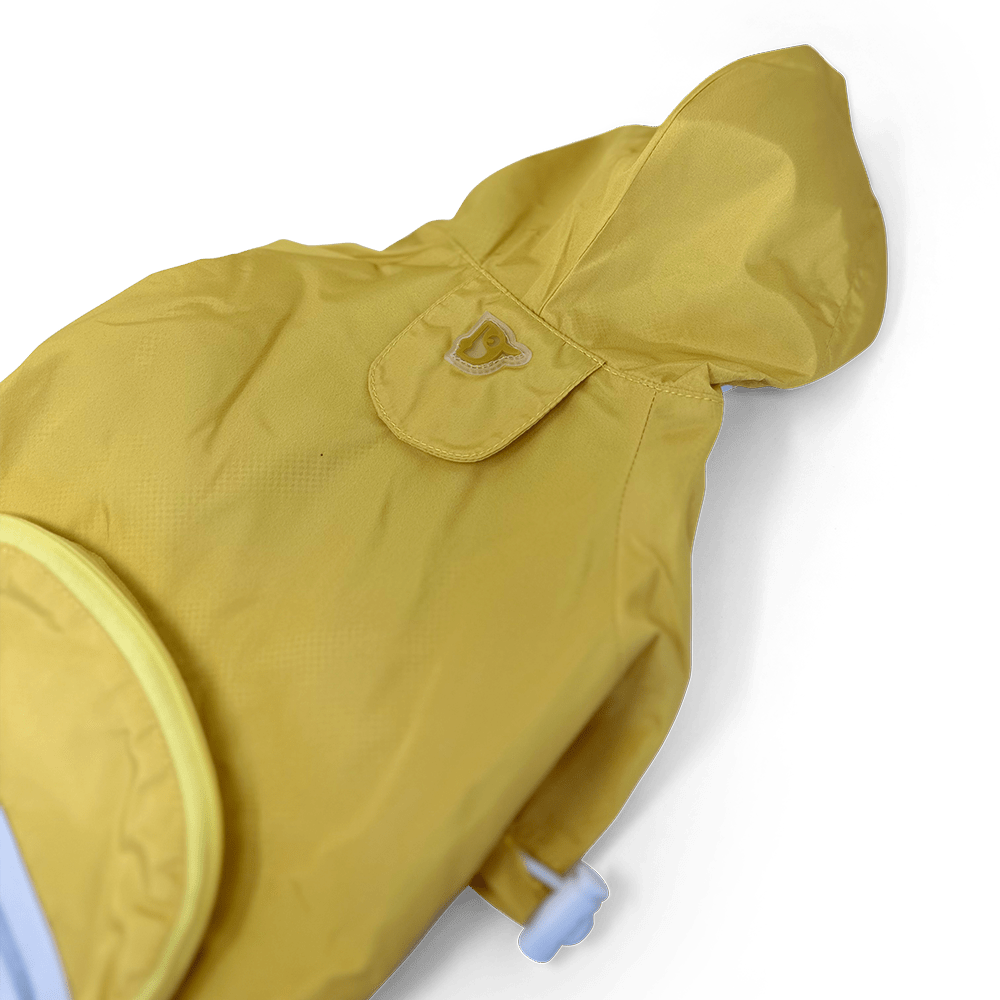 Yellow raincoat hood detail with small emblem patch on the upper back