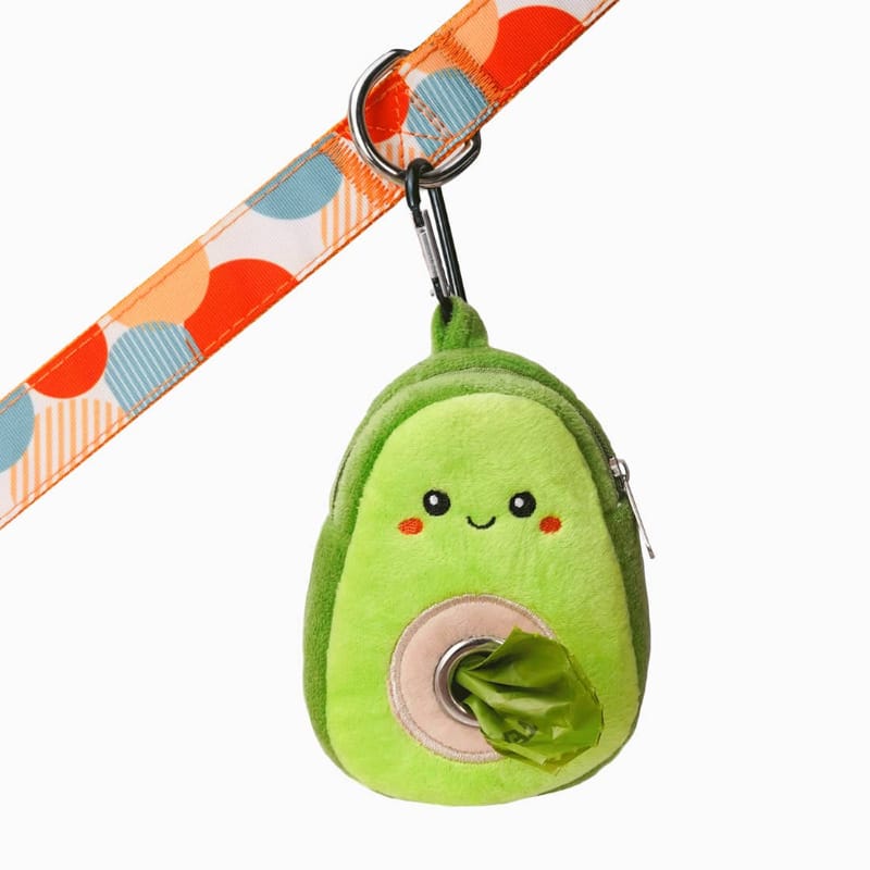 Plush avocado waste bag dispenser with patterned strap and open bag pouch