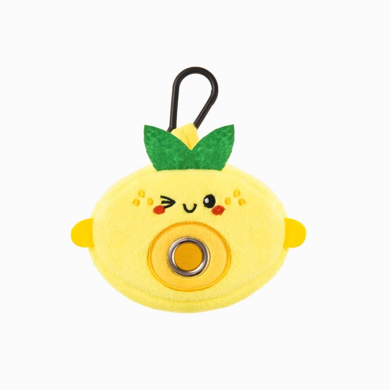 Lemon-shaped plush pet waste bag dispenser with black loop handle and smiling face