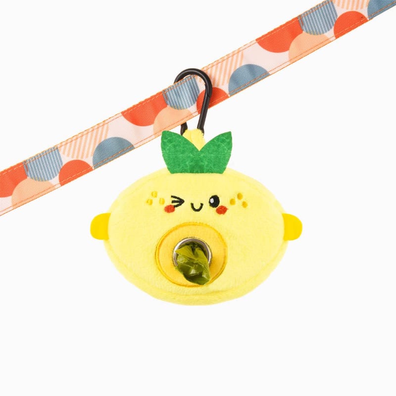 Lemon plush pet waste bag dispenser with green bag holder front and ribbon strap