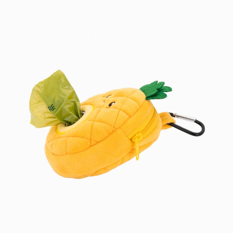 Pineapple pet waste bag dispenser pouch holding a green bag with carabiner clip