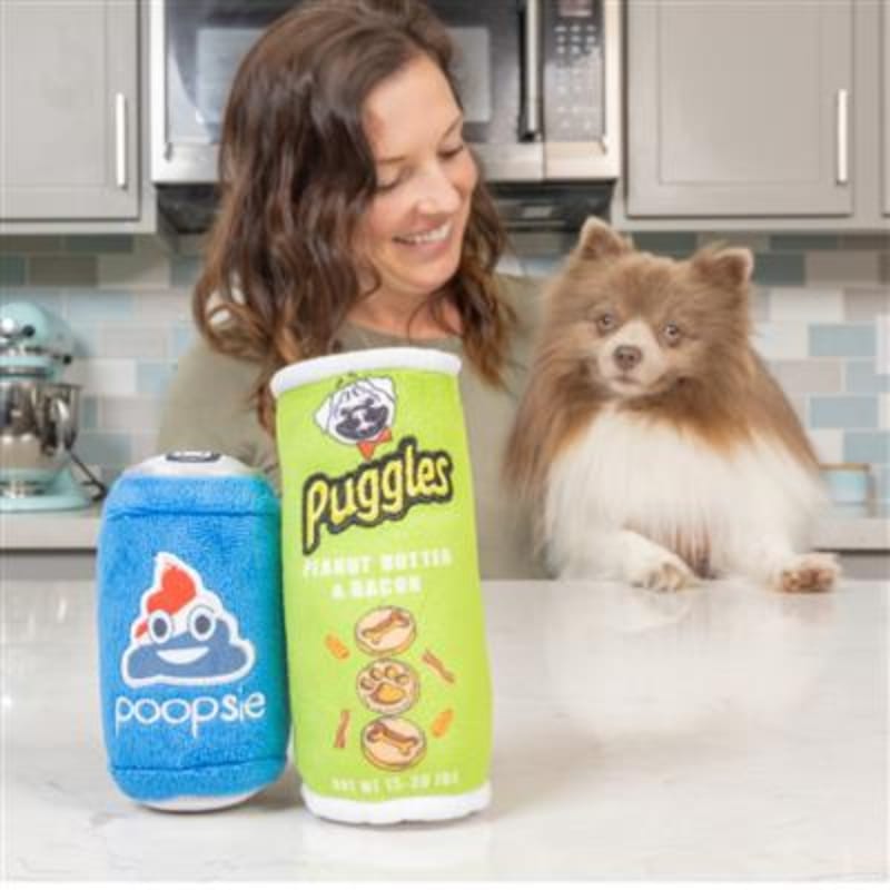 Plush pet toy set: blue Poopsie and green Puggles canisters beside a dog.