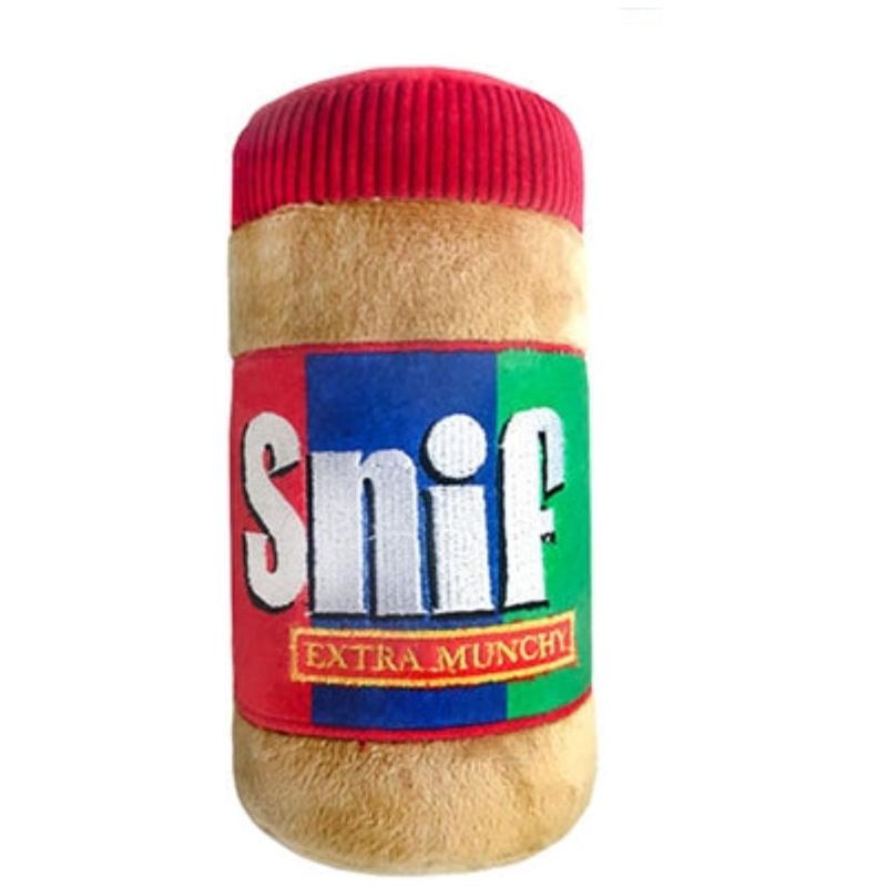 Plush dog toy cylinder with beige fur, red top, and Snif Extra Munchy label