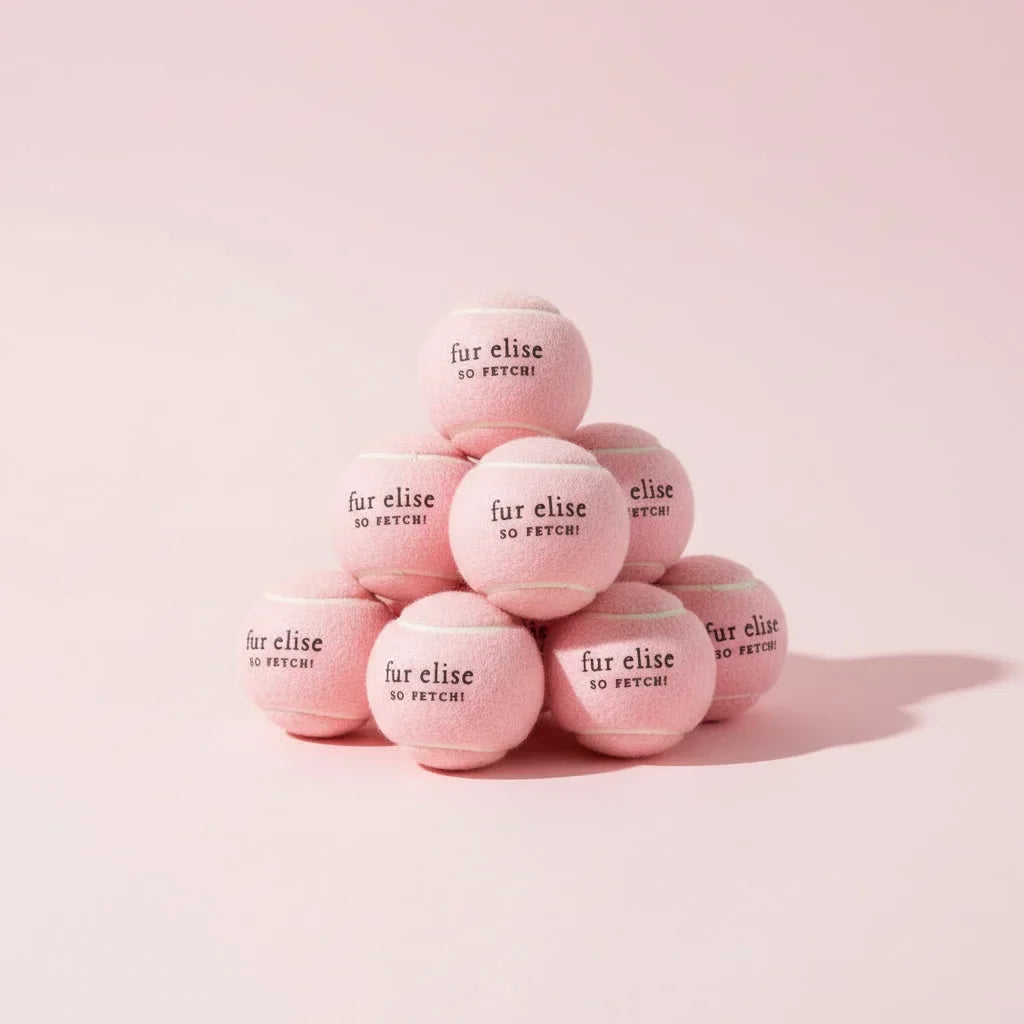 Blush tennis ball set of 7 stacked, each shows 'fur elise so FETCH!'