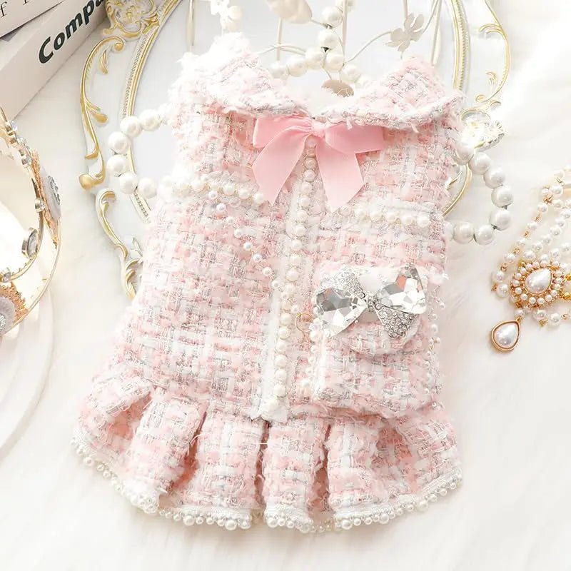 Pink tweed dog dress with lace collar bow, crystal brooch, and pearl buttons