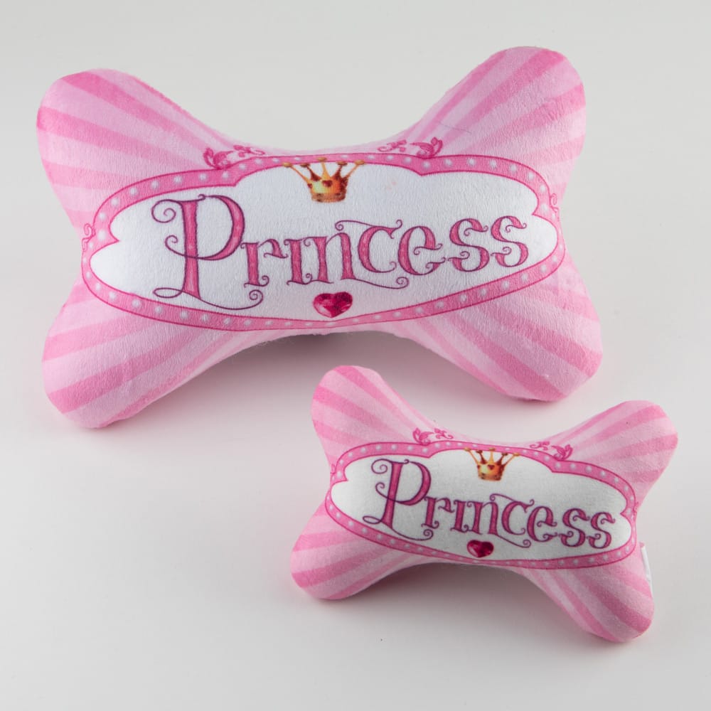 Pink plush dog toy bone-shaped bow with 'Princess' print and heart crown detail