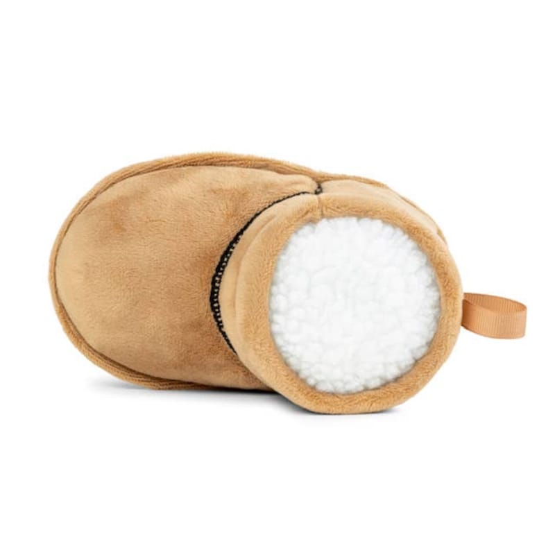 Tan plush boot dog toy with open white fuzzy interior and beige loop handle