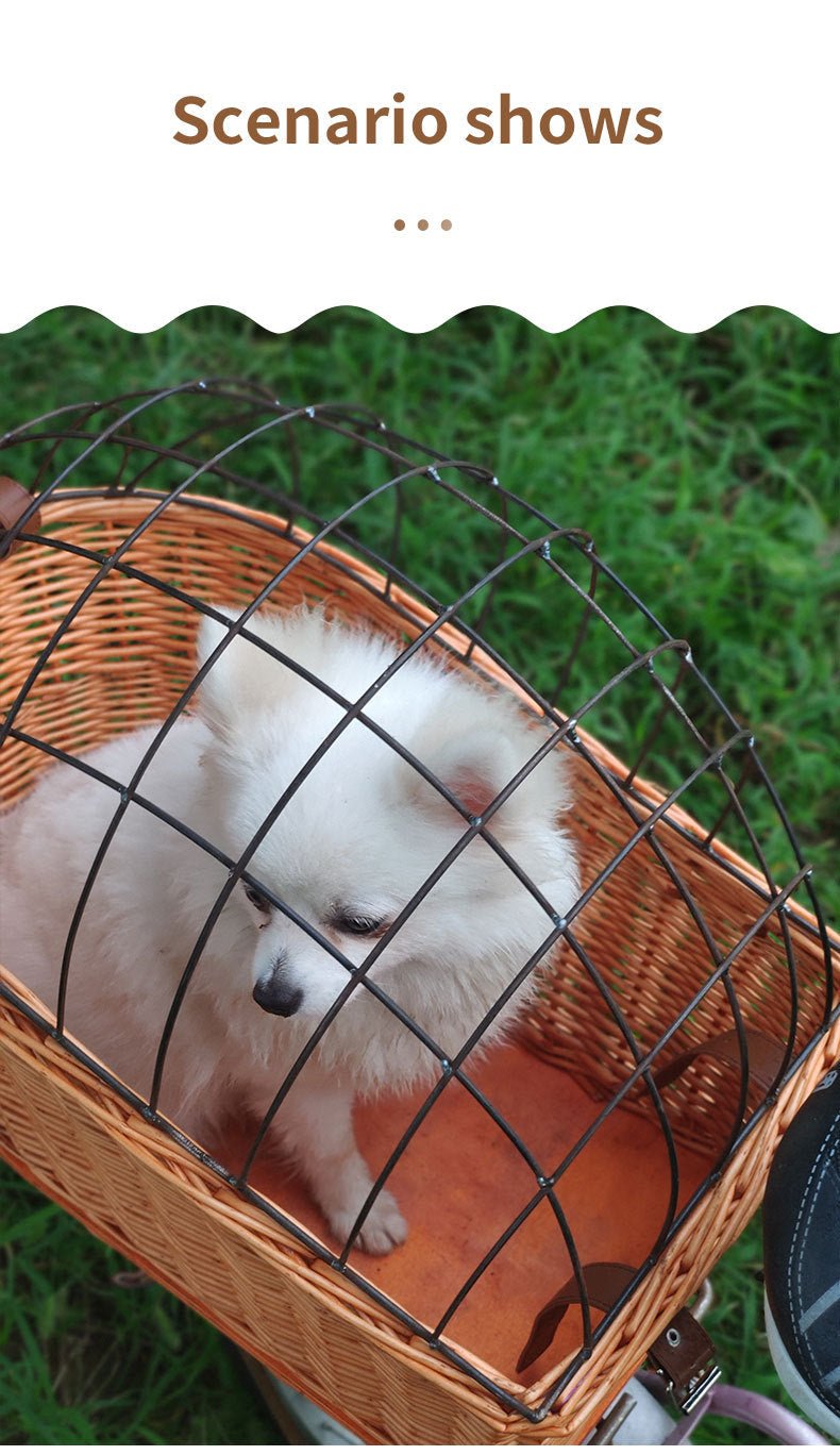 Honey rattan pet basket with black metal bars; dog resting inside