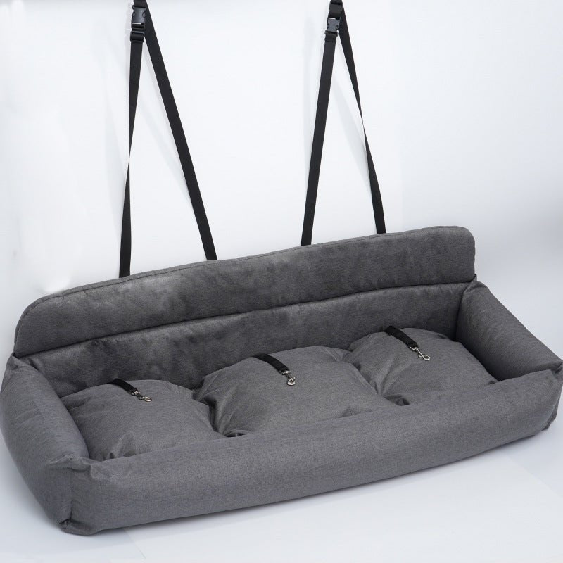 Dark gray car pet bed with padded bolsters and several fastening loops on top