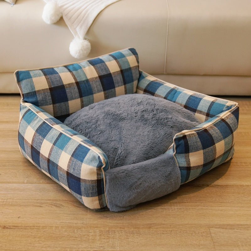 Blue plaid pet bed with plush gray cushion and cushioned side bolsters