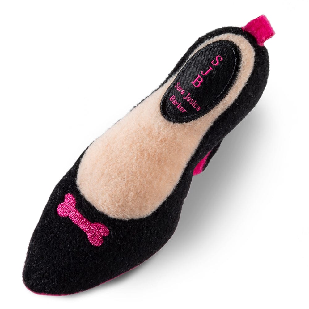 Plush squeaky dog shoe toy, black felt with pink bone, beige top panel and label