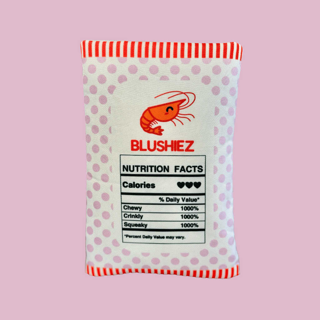 Plush shrimp chip dog toy with nutrition facts label on the back panel