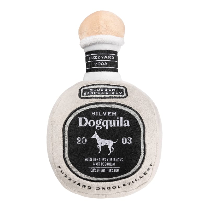 Light gray bottle-shaped plush dog toy with squeaker and dark label