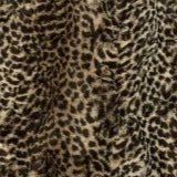 Cheetah ombre blanket fabric close-up with mottled spotted pattern