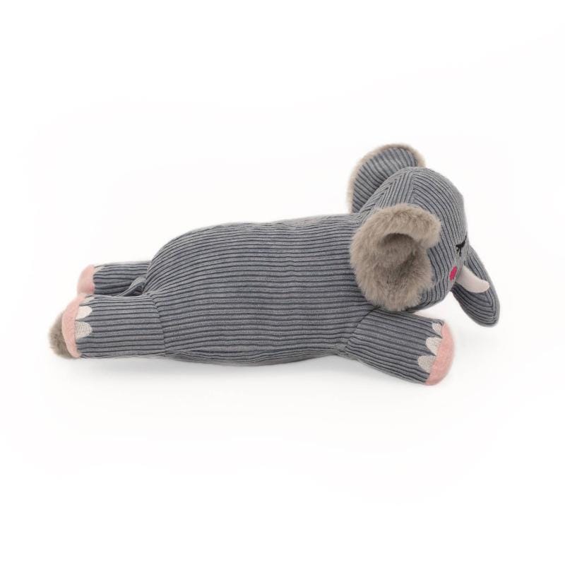 Plush elephant dog toy lying down, gray striped body, tan ears, pink paw pads.