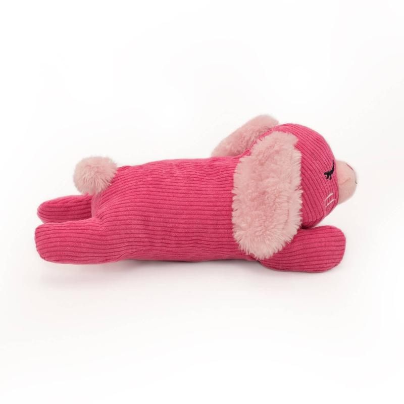 Pink bunny plush dog toy, side view lying down with fuzzy ear panel and stitched paws