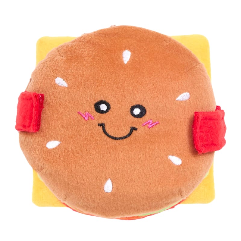 Cheeseburger plush dog toy with smiling bun face, white sprinkle dots, red side pads