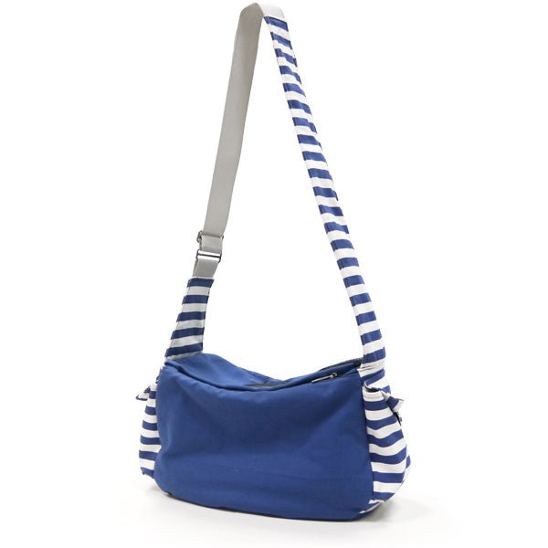 Blue soft sling bag with striped shoulder strap and zippered front pocket