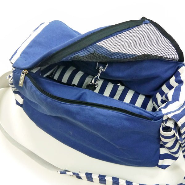 Blue sling bag open view with zip top, striped lining, and mesh interior
