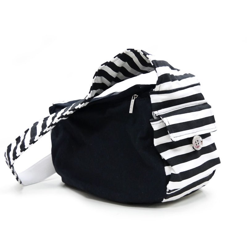Black soft sling bag with white horizontal stripes, top handle and front zipper