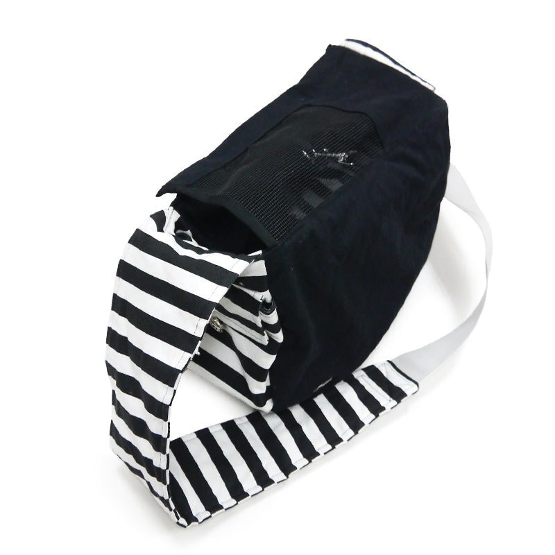 Soft sling bag in black with black mesh top panel and white-and-black striped accents