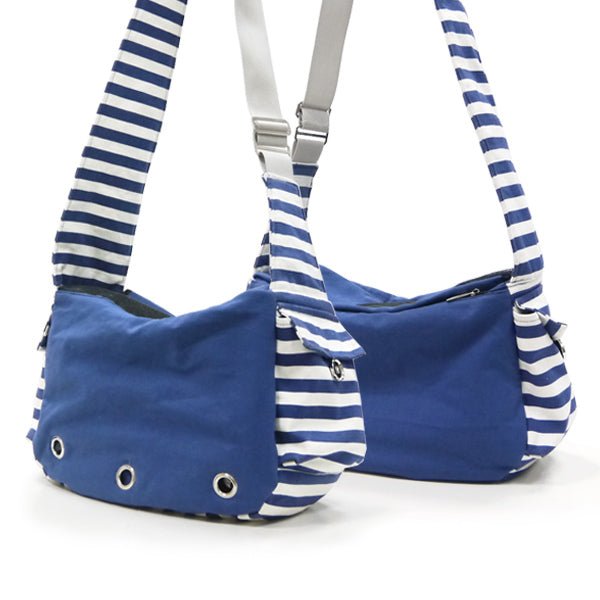 Soft sling bag in blue with white-and-navy striped shoulder straps and metal eyelets