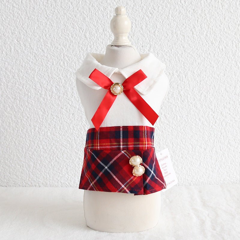 Pet outfit dress with white top, red bow, and red plaid skirt with pearl button detail