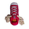 Pink plush dog sneaker toy with white laces, rope handles, and front treat pocket