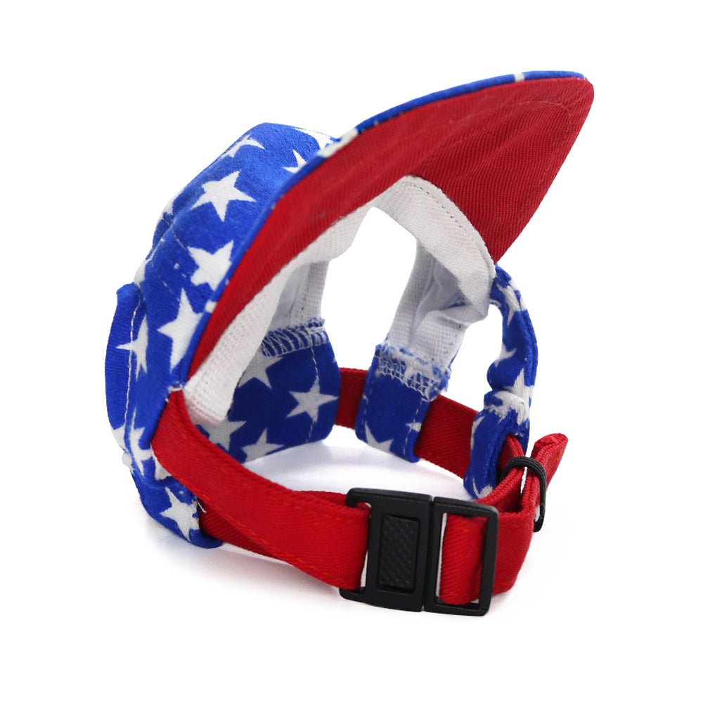 Blue star-print dog hat with red inner rim and adjustable chin strap