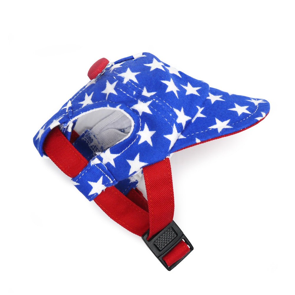 Blue star-print dog hat with red chin strap and soft white lining